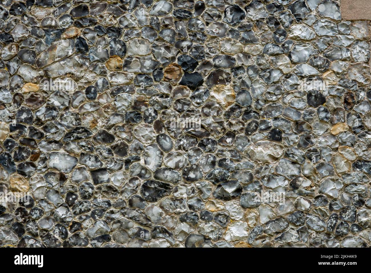 Sezione di parete di pietra focaia di vampate Foto Stock