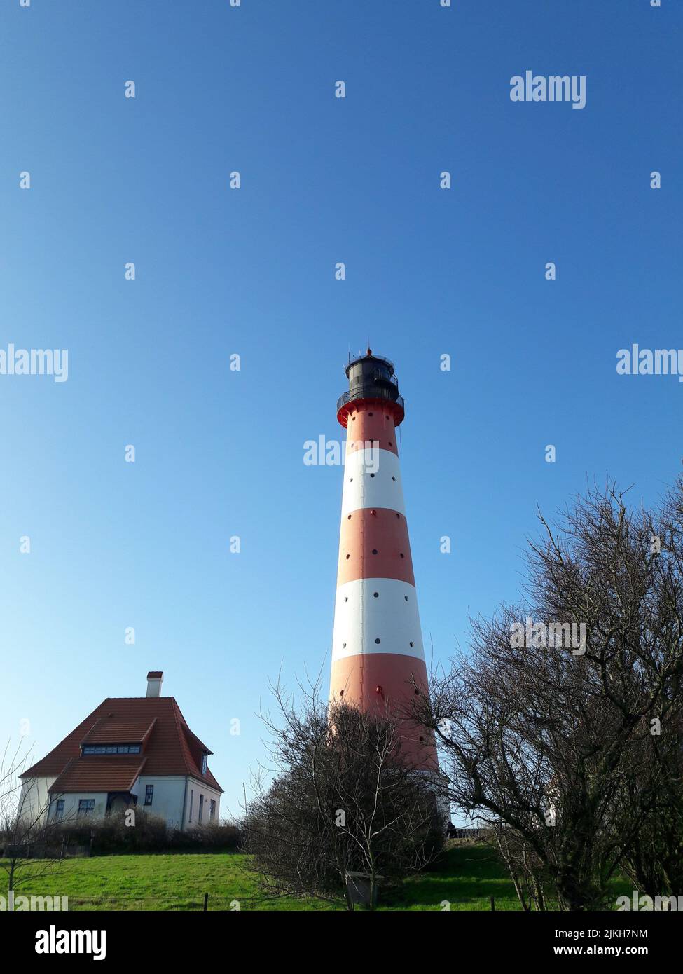 Il faro di Westerhesversand a Westerhever, Schleswig-Holstein, Germania Foto Stock