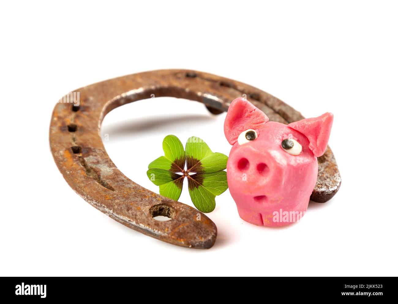 horseshoe con verde shamrock segno per fortuna per san patricks giorno isolato su uno sfondo bianco Foto Stock