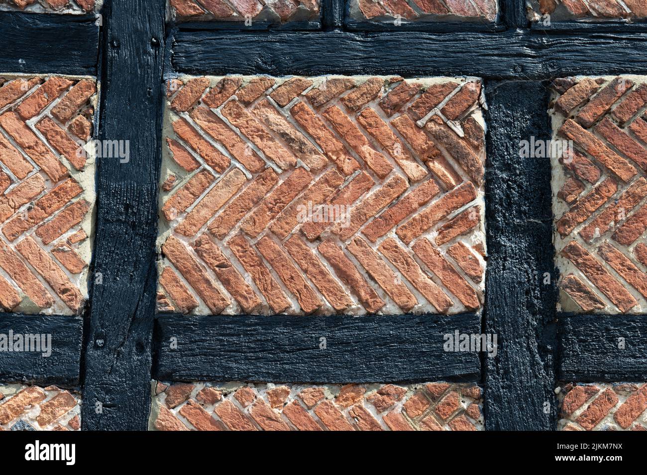 Tudor brick nogging in herringbone modello - Inghilterra, UK Foto Stock