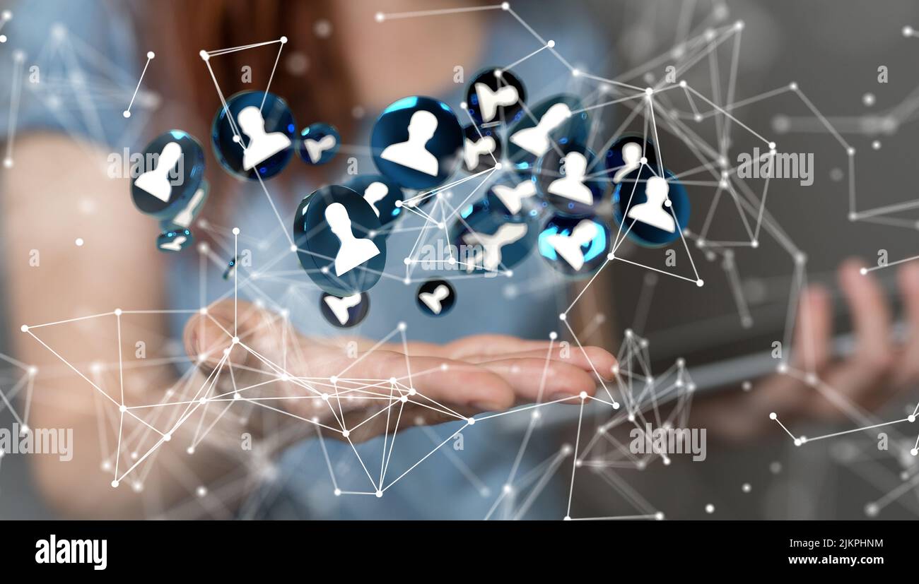 Una mano femminile che tiene 3D icone umane rese, un concetto di gestione delle risorse umane e di reclutamento Foto Stock