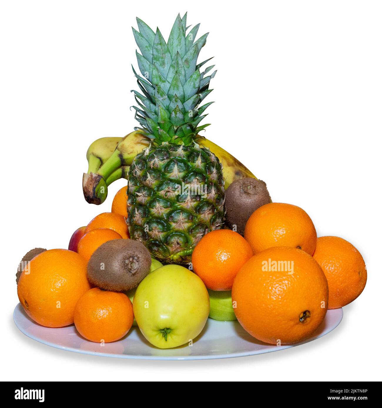 Frutta e verdura fresca su un piatto bianco. Isolato Foto Stock