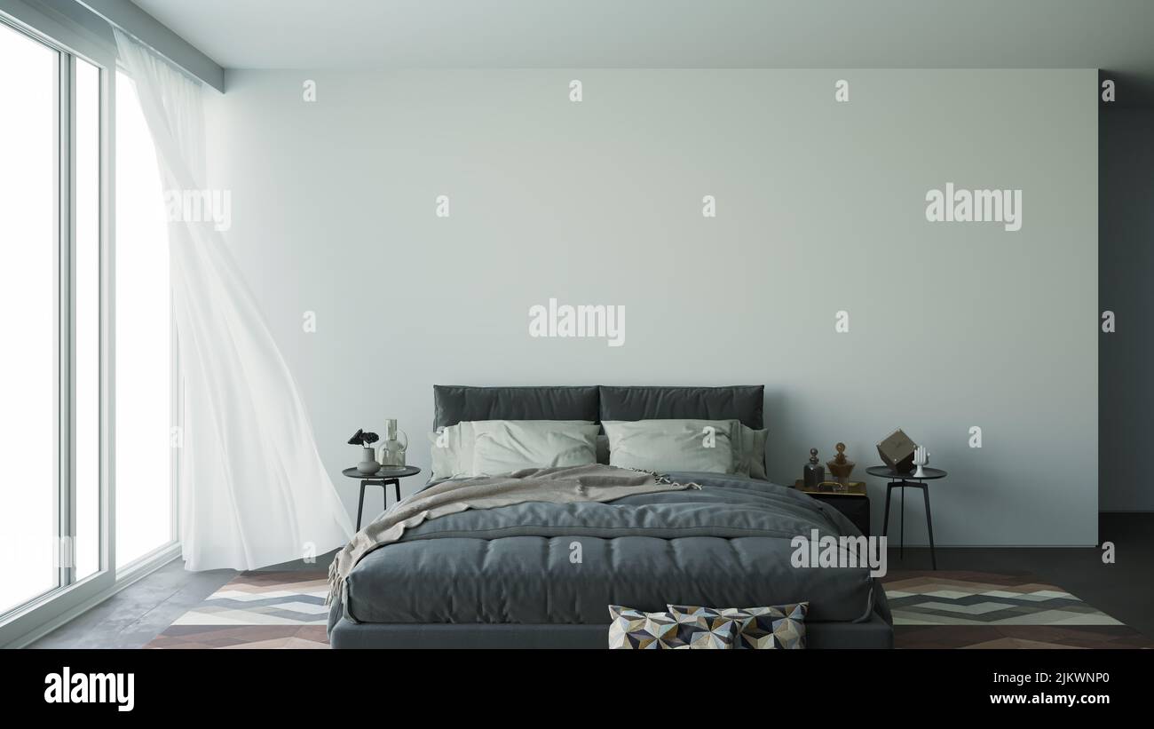 Una camera da letto moderna con un letto grigio Foto Stock