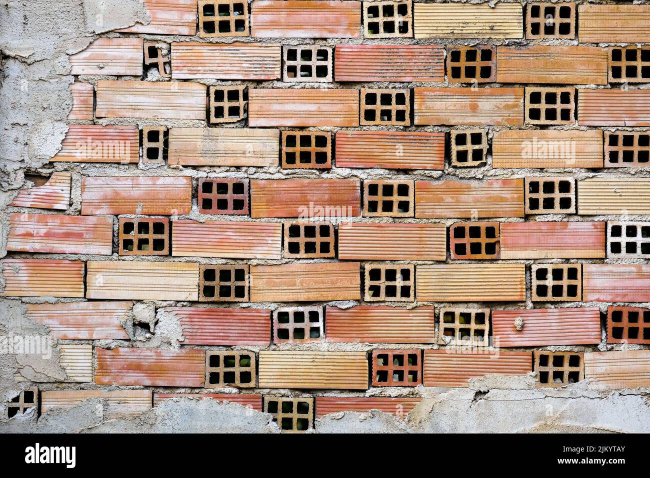 Un primo piano di una costruzione di muro di mattoni incompiuta Foto Stock