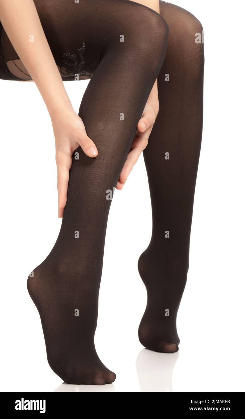 Dolore alle gambe del polpaccio sfregamento delle mani Foto Stock
