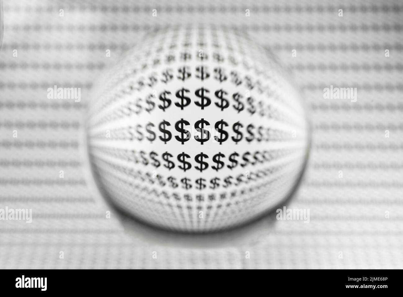 Globo di vetro con segni del dollaro Foto Stock