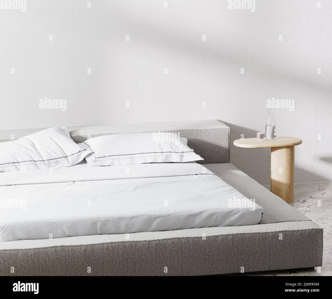 Camera con letto e cuscini e comodino con parete bianca su sfondo, 3D rendering Foto Stock