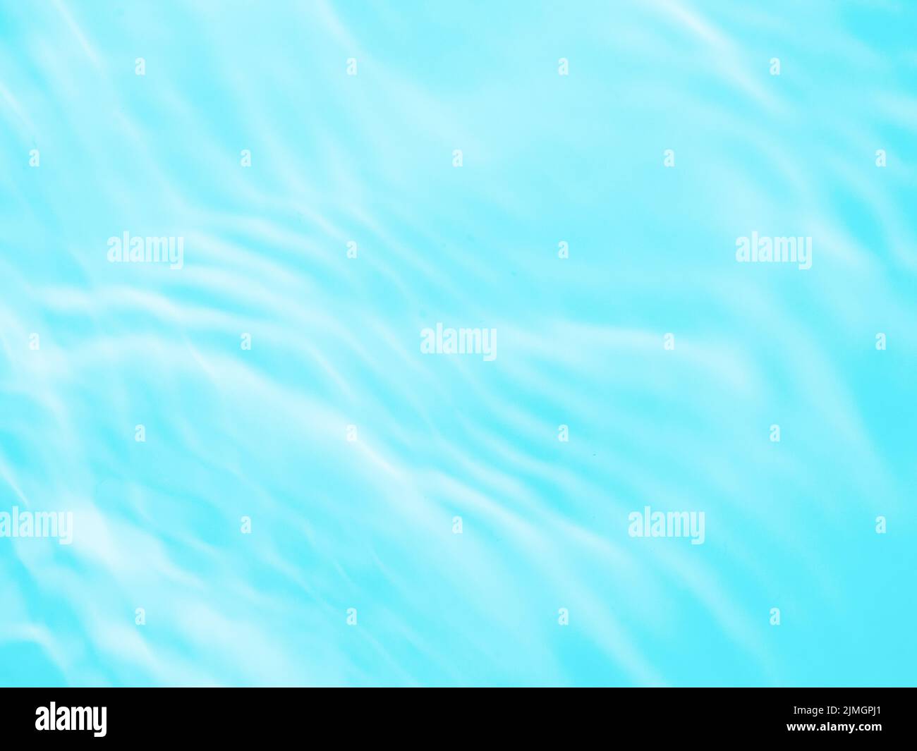 Ondola la texture dell'acqua con le ombre sul blu Foto Stock