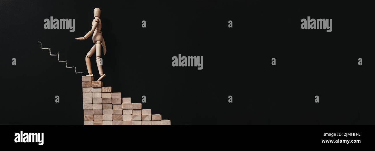 sviluppo personale manichino arrampicata scale Foto Stock