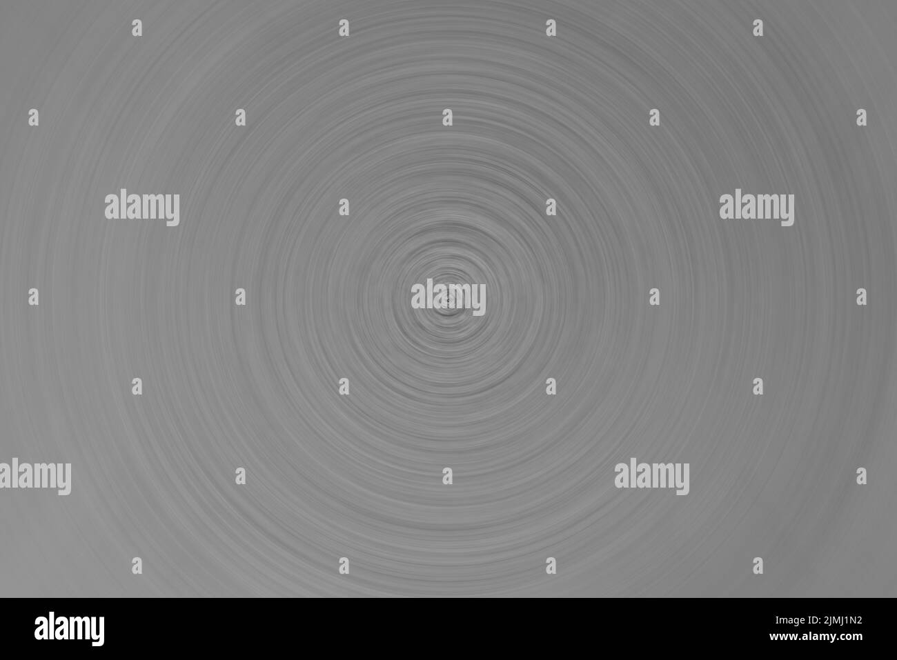 Abstract di sfondo grigio cerchio spin radiali di Motion Blur. Foto Stock