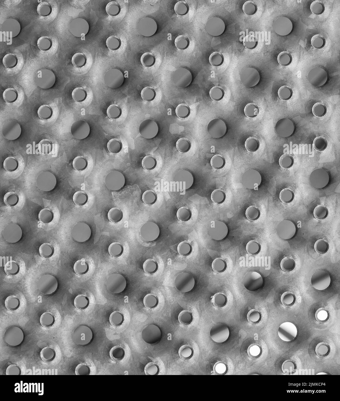 Pannello con foro rialzato perforato. Lamiera antiscivolo con fori. Sfondo. Texture. Foto Stock
