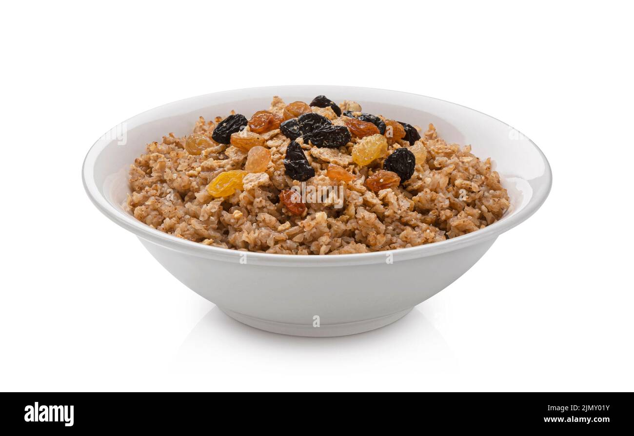 Ciotola di fiocchi di grano saraceno isolato su sfondo bianco Foto Stock