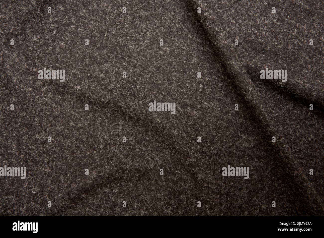 feltro grigio piegato con una struttura grossolana Foto Stock