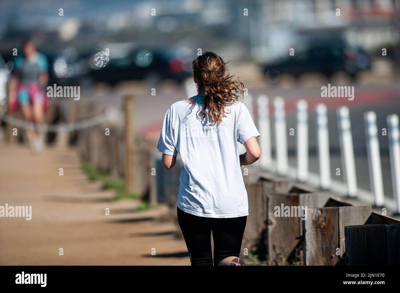 Immagine di una donna in fuga mattutina. Trail Runner, Beach Runner, San Francisco, California, West Coast, Salute, benessere, esercizio fisico Foto Stock