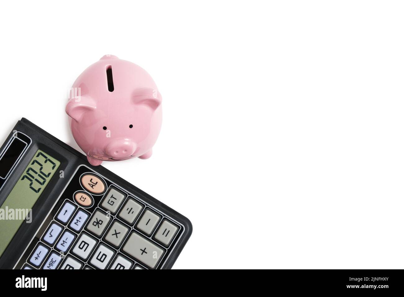 Calcolatrice e banca piggy sfondo bianco.concetto famiglia bilancio e business Foto Stock
