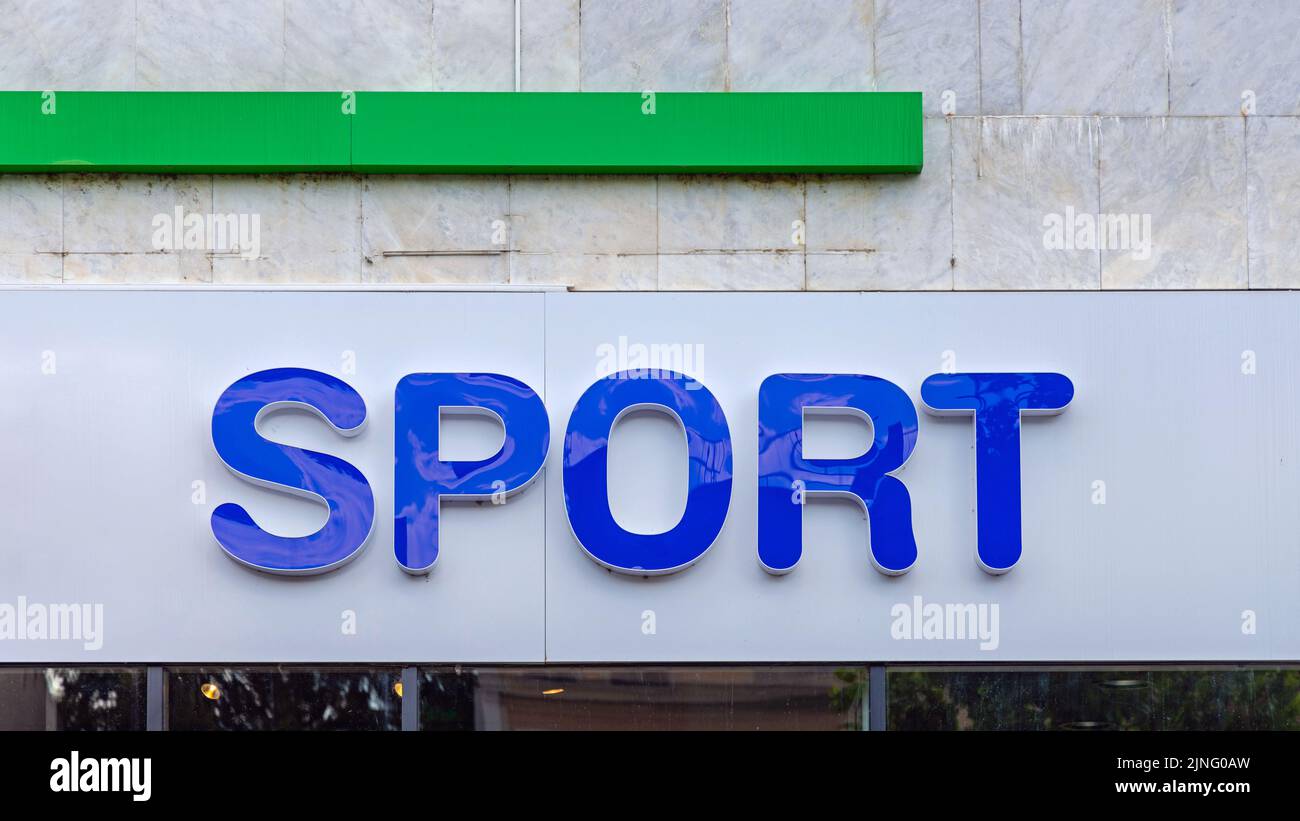 3D Blue Sign Sport all'esterno dell'edificio Foto Stock