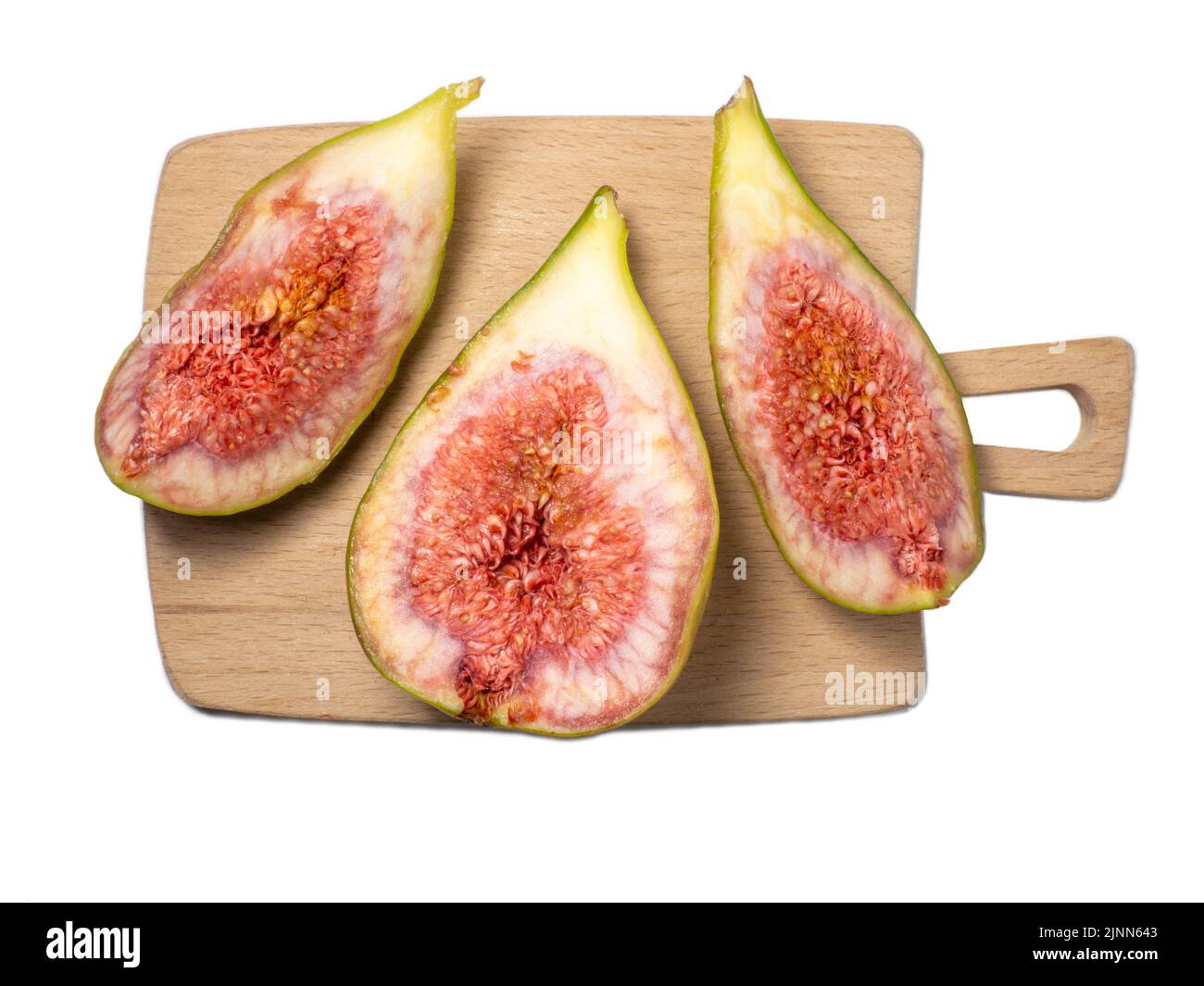 affettato fichi su un tagliere. Frutta matura e succosa su fondo bianco. Cibo di dieta. Fig. Isola. Semi Inside. Concetto di frutta Foto Stock