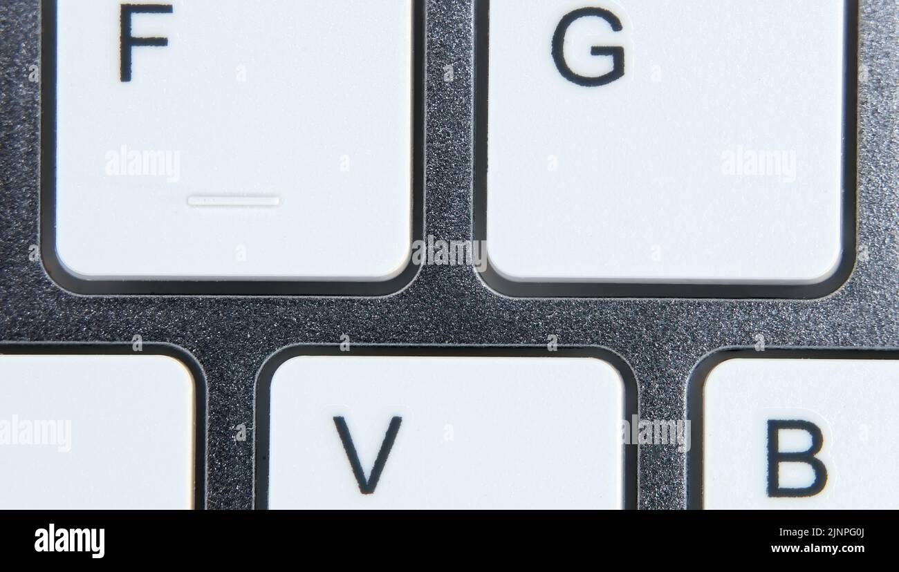 Primo piano della tastiera di un computer, con i tasti bianchi. Foto Stock