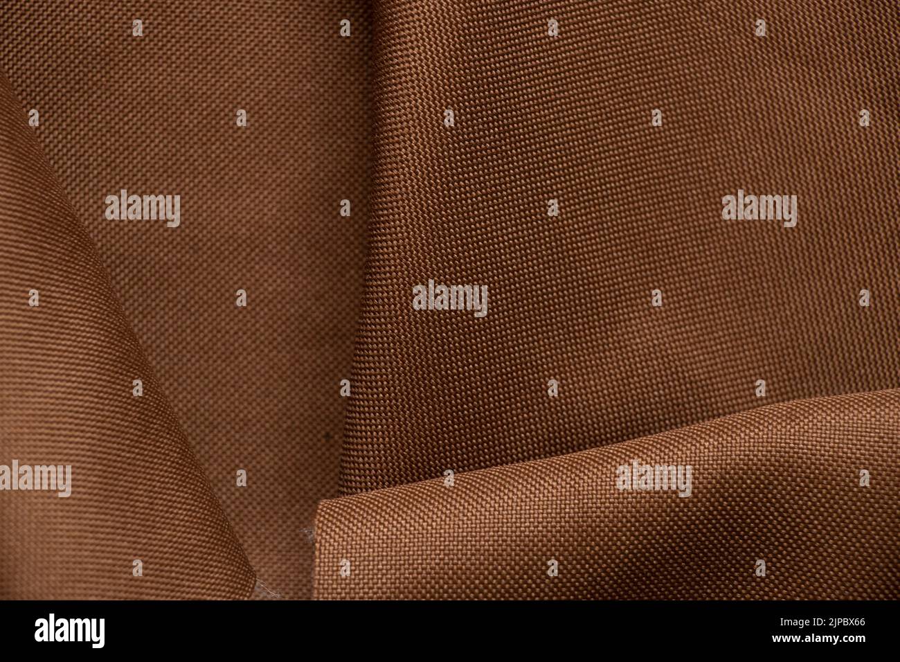Tessuto marrone chiaro per il primo piano dello sfondo, tessuto per lo sfondo Foto Stock