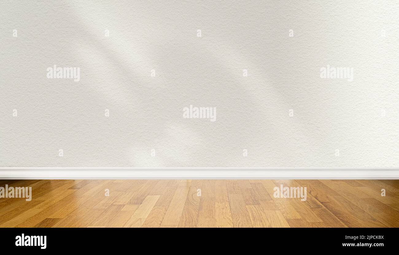 Vista frontale del pavimento in parquet di legno e delle pareti bianche di beige chiaro con ombre astratte Foto Stock