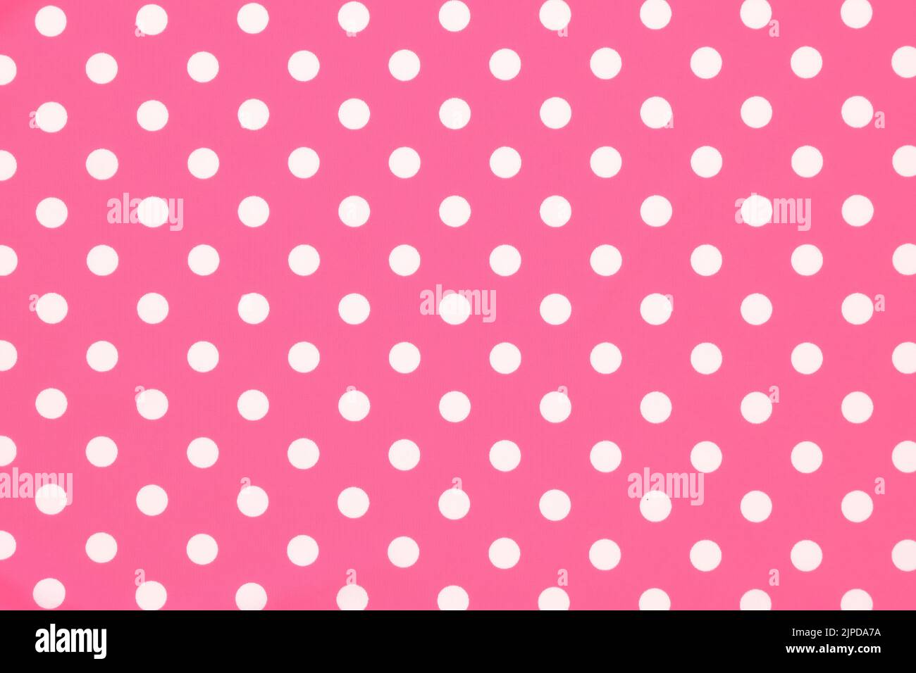 Pink polka dot tessuto modellato swatch sfondo piatto Foto Stock