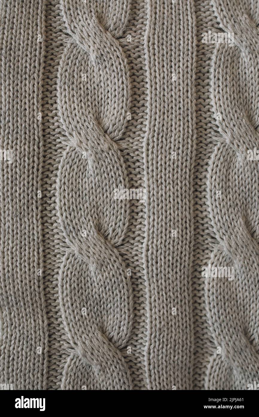 Primo piano di morbido sfondo grigio Cashmere Cable Knit pattern texture Foto Stock
