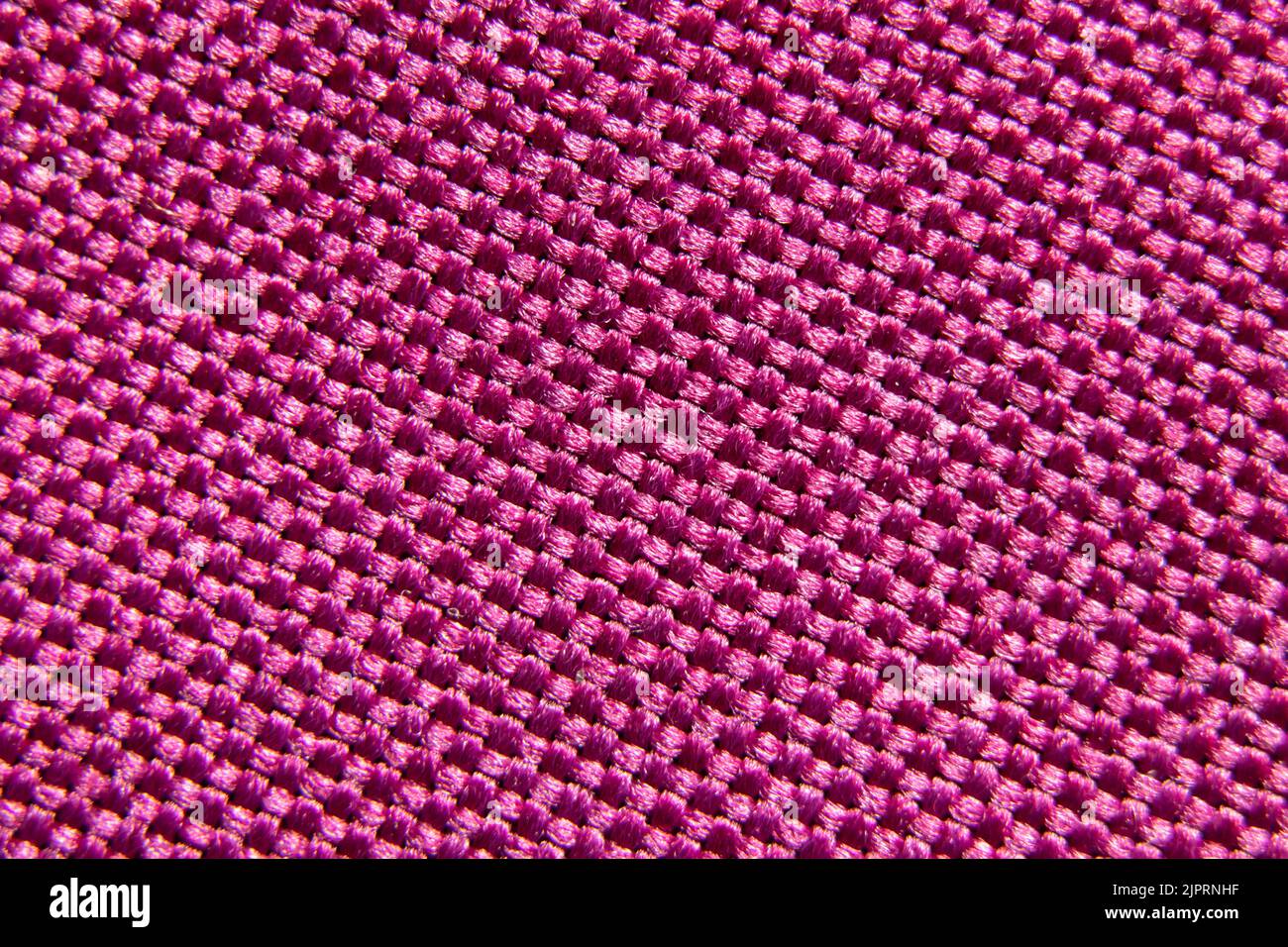 Tessuto rosa per lo sfondo, tessuto per la foto macro di sfondo Foto Stock