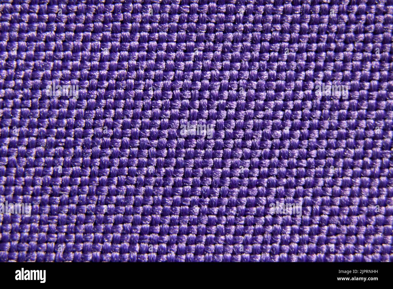 Tessuto viola per lo sfondo, tessuto per la foto macro di sfondo Foto Stock