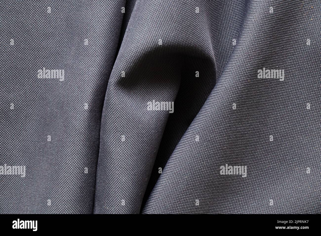 Tessuto grinzito grigio per lo sfondo, tessuto per la foto macro di sfondo Foto Stock