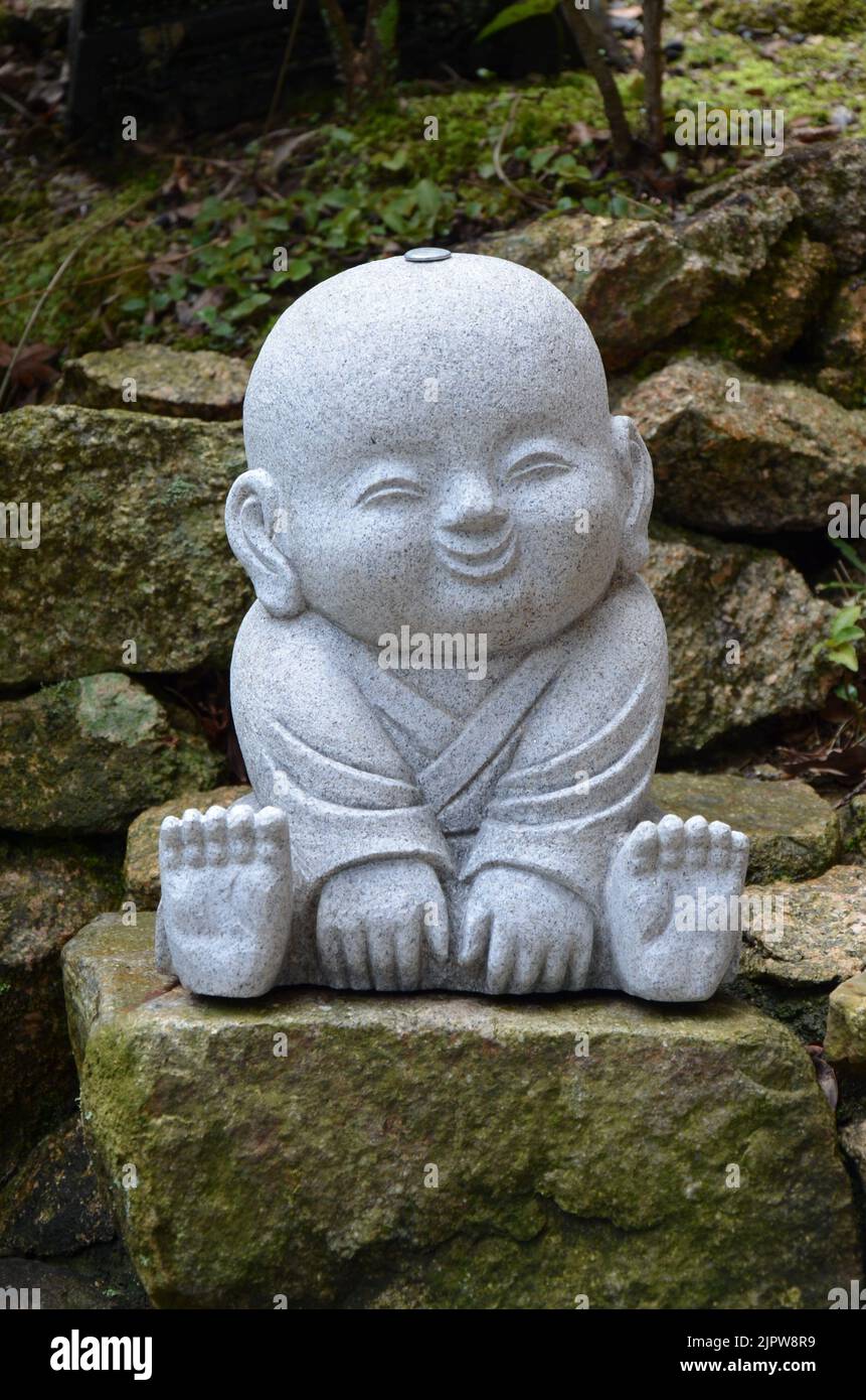 Jizo Bosatsu, statua del monaco buddista al Tempio di Daishoin, isola di Miyajima, Giappone Foto Stock