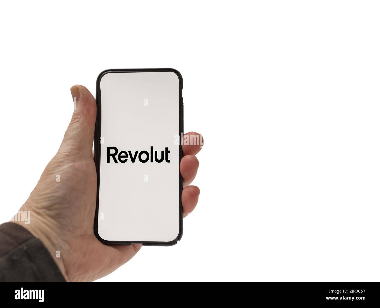 Cardiff Mid Glamorgan UK Agosto 20 2022 persona che tiene il cellulare con il logo Revolut Bank su uno sfondo bianco Foto Stock