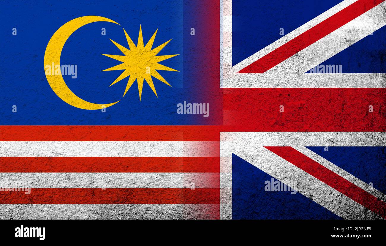 Bandiera nazionale del Regno Unito (Gran Bretagna) Union Jack con bandiera nazionale della Malesia. Sfondo grunge Foto Stock