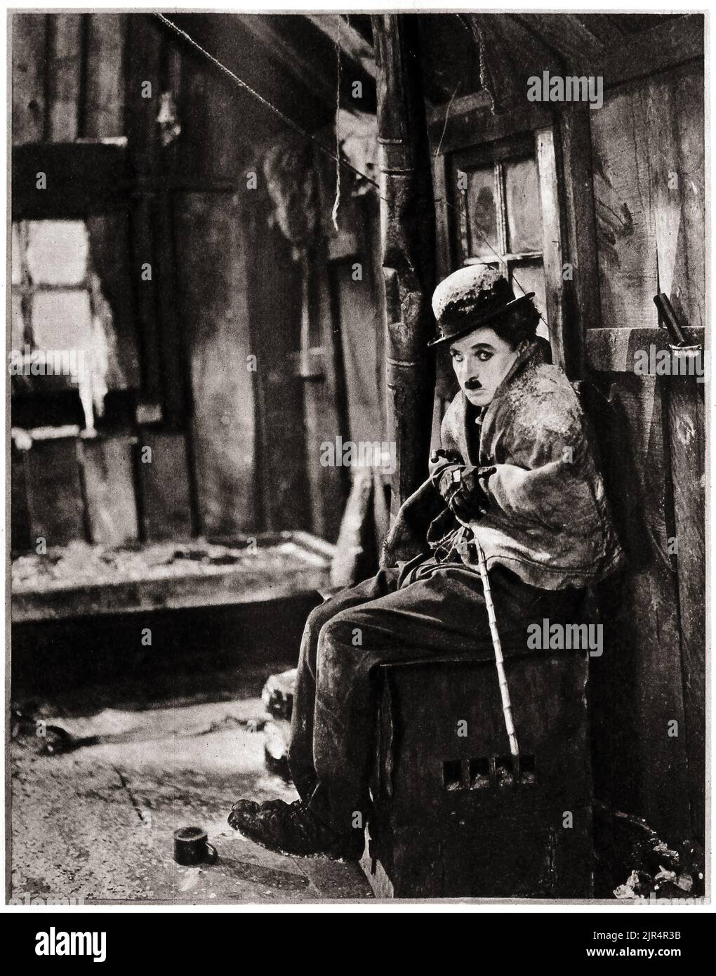Charlie Chaplin - Chilkoot Pass - pubblicità ancora per il prossimo film che sarebbe diventato la corsa all'oro. The Gold Rush è un film comico americano del 1925 scritto, prodotto e diretto da Charlie Chaplin nel 1925. Foto Stock