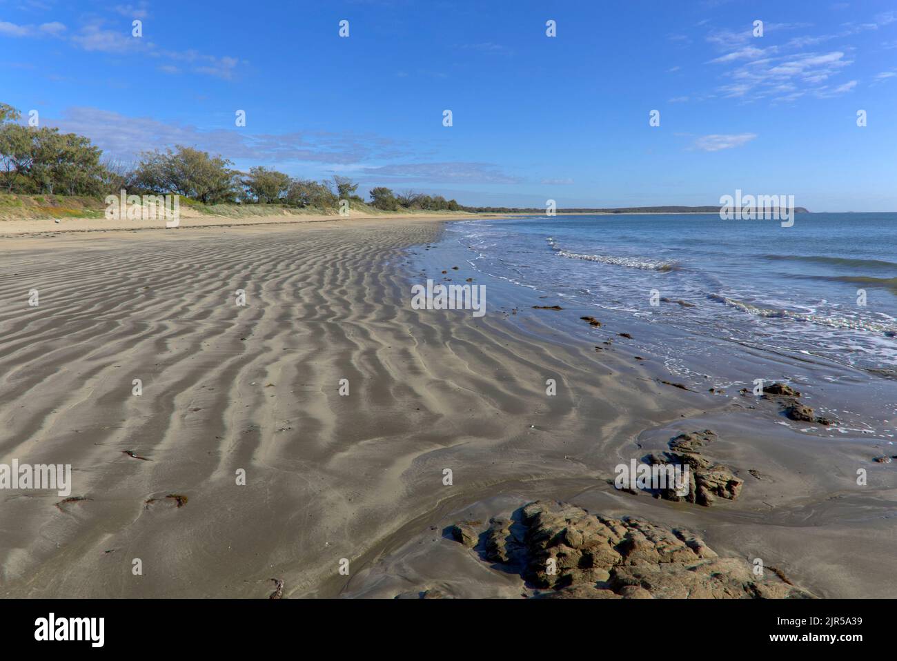 La spiaggia sulla costa orientale Southend Curtis Island Queensland Australia Foto Stock