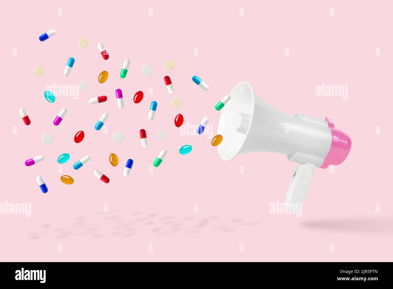 Medicina sfondo fatto di bianco-rosa megafone e pillole colorate. Concetto di virus epidemico minimo. Foto Stock