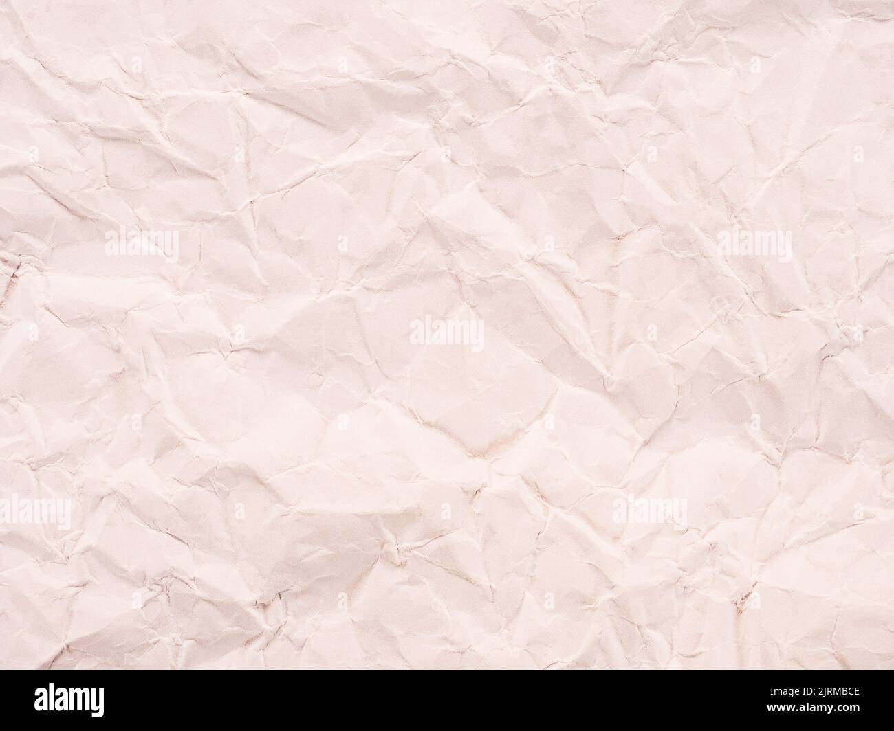Trama di carta stropicciata come sfondo astratto con tinta calda Foto Stock