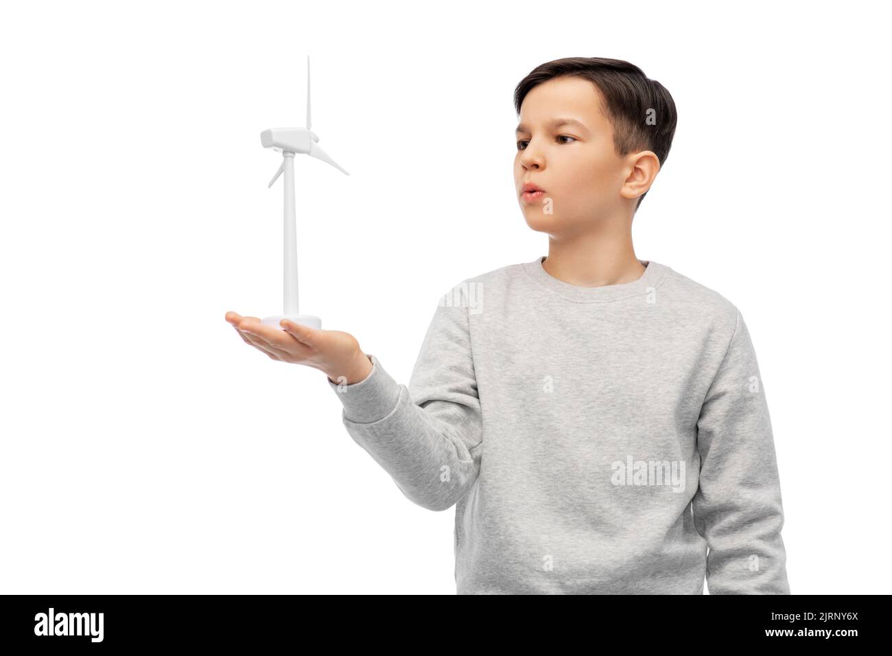 ragazzo con turbina eolica giocattolo Foto Stock