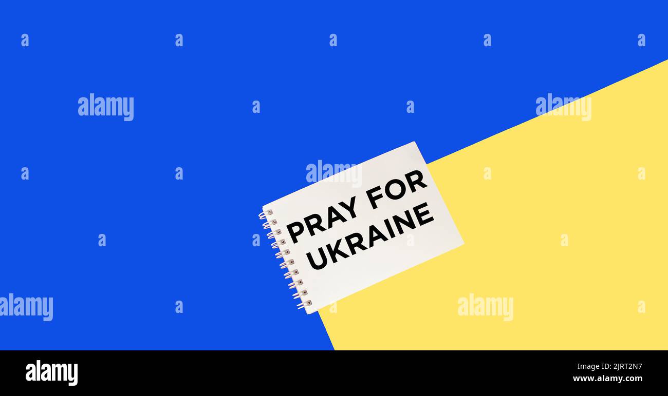 Pregate per il testo dell'Ucraina nei colori della bandiera giallo-blu Foto Stock