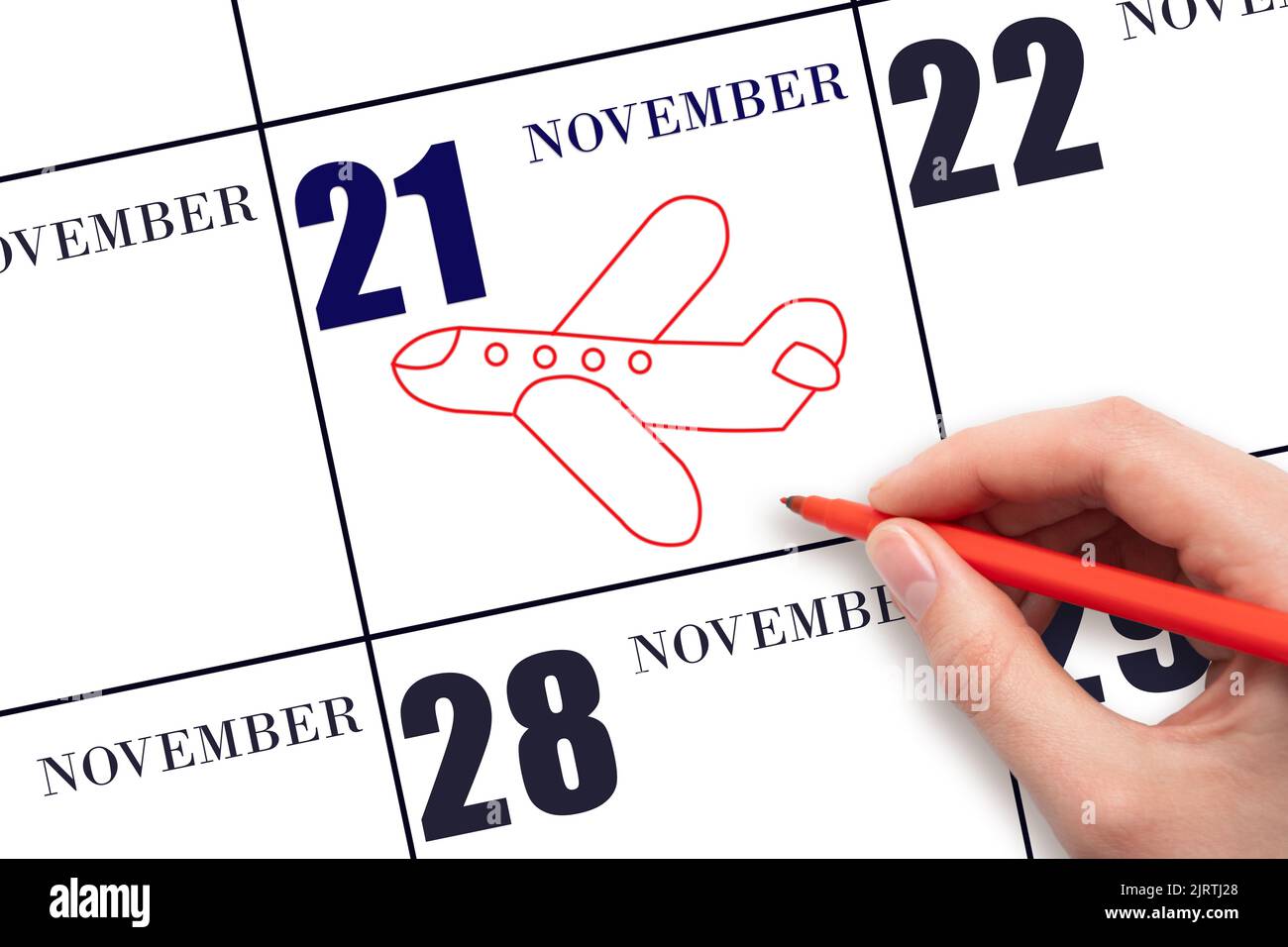 21st° giorno di novembre. Un disegno a mano del profilo dell'aeroplano alla data di calendario 21 novembre. La data del volo in aereo. Viaggi, viaggi d'affari. Lunedì d'autunno Foto Stock