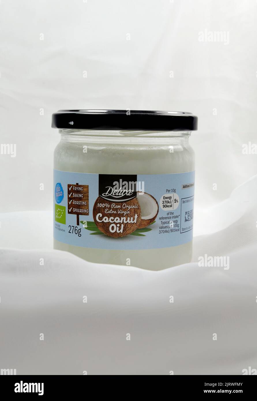 Olio di cocco in un vaso di vetro. Configurazione di Studio Foto Stock