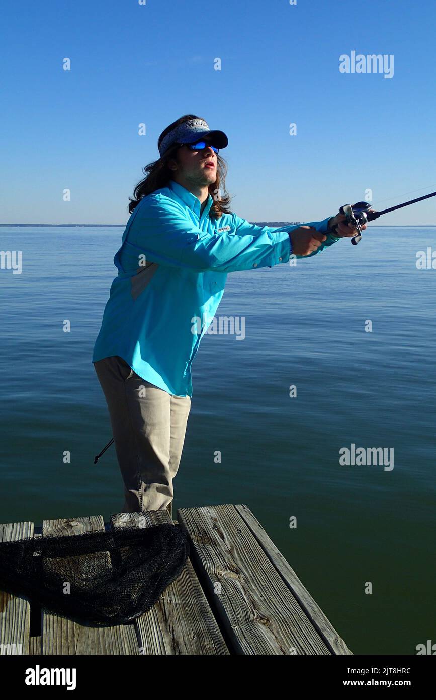 Andrew, pesca per gli stripers. Foto Stock
