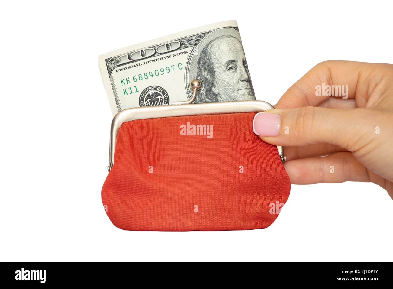 Un centinaio di dollari in un portafoglio rosso sta tenendo una mano femminile su un fondo bianco, finanza ed economia, dando soldi Foto Stock