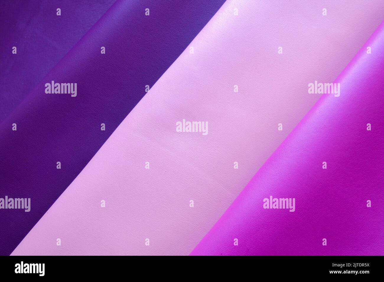 Primo piano di morbida nappa viola, rosa e viola. Foto Stock