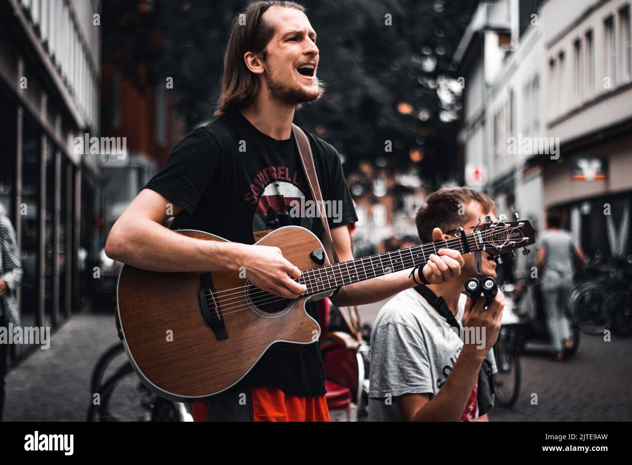 Persone che suonano musica per le strade di Münster Foto Stock