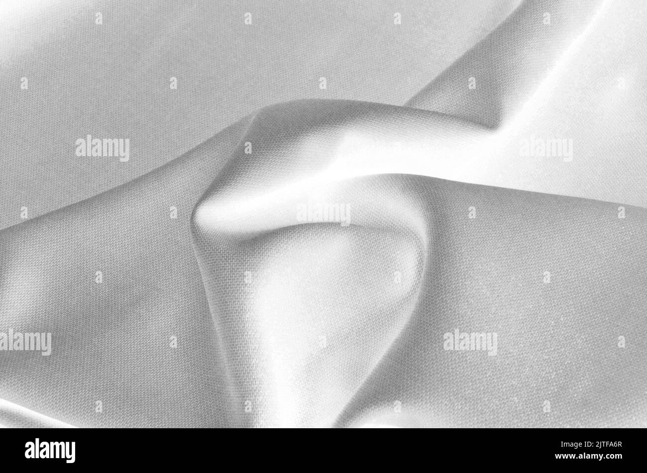 primo piano crumpled tessuto nero e bianco sfondo astratto Foto Stock