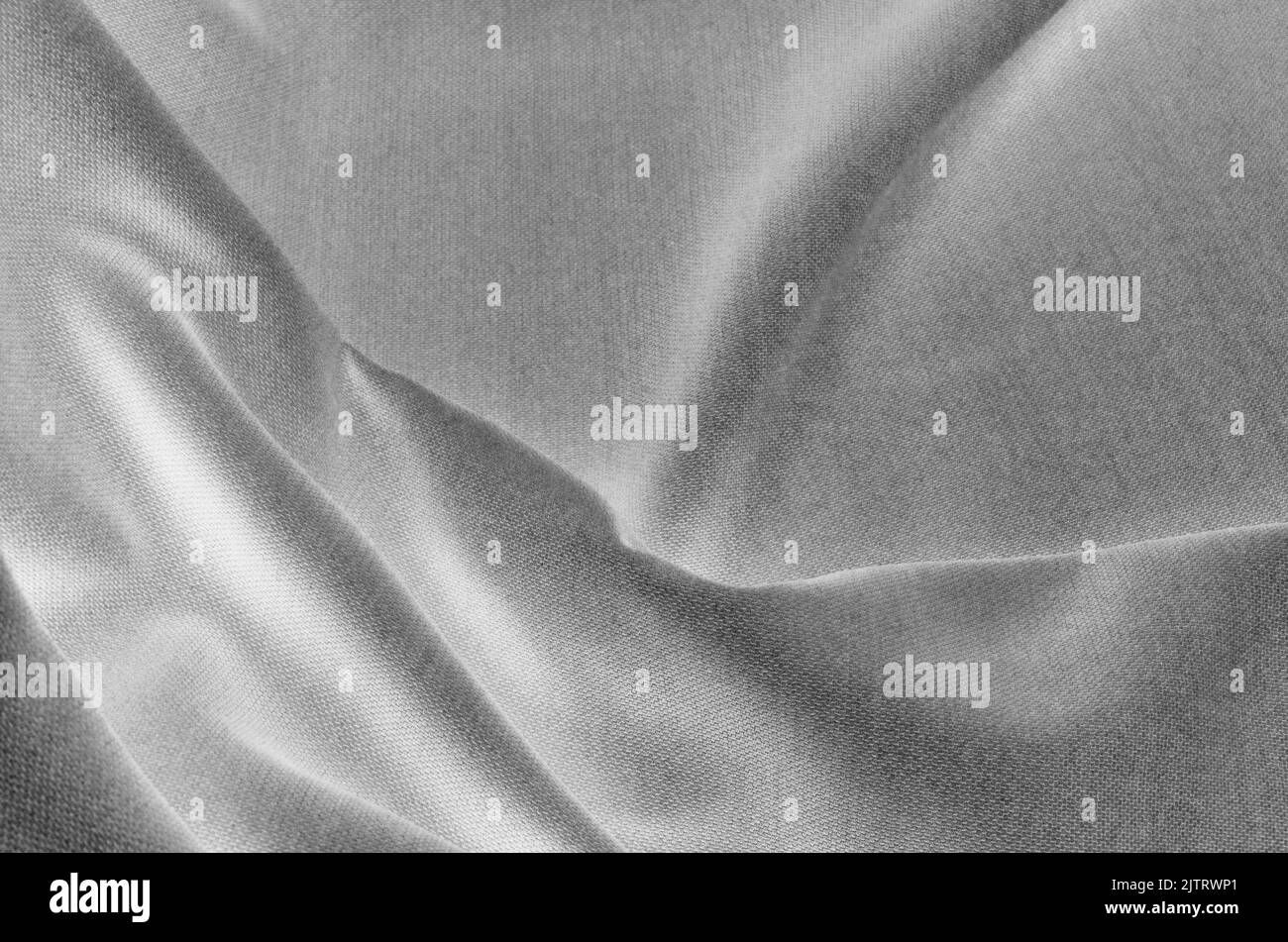 primo piano crumpled tessuto nero e bianco sfondo astratto Foto Stock