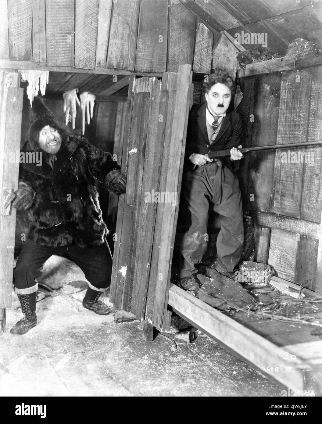 MACK SWAIN e CHARLIE CHAPLIN in ORO RUSH 1925 regista / scrittore CHARLES CHAPLIN Charles Chaplin Productions / Artisti Uniti Foto Stock