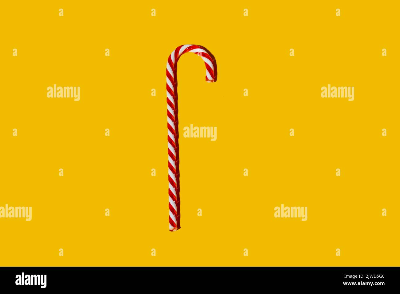 caramella canna decorazione natalizia festa lollipop arancione Foto Stock