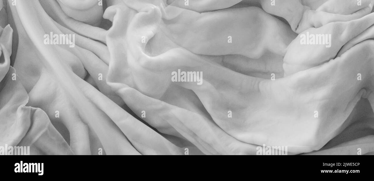 primo piano crumpled tessuto nero e bianco sfondo astratto Foto Stock