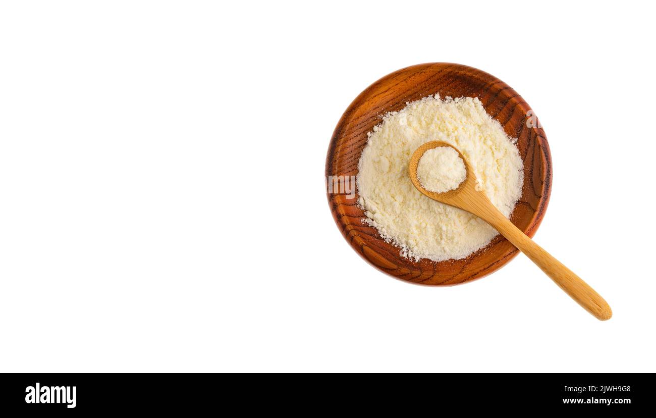 Latte in polvere o disidratato nel recipiente e nel cucchiaio Foto Stock